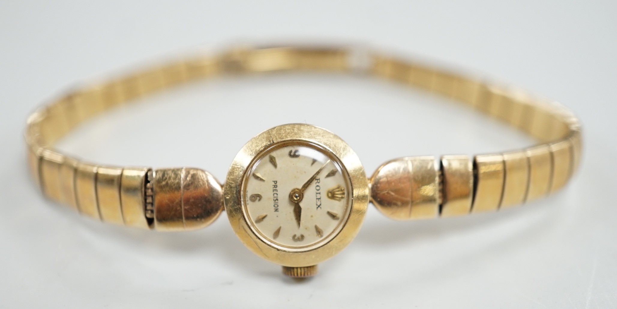 A lady's 9ct gold Rolex Precision manual wind wrist watch, on 9ct gold Rolex bracelet, case diameter 16mm, gross weight 16.8 grams, with Rolex box.
